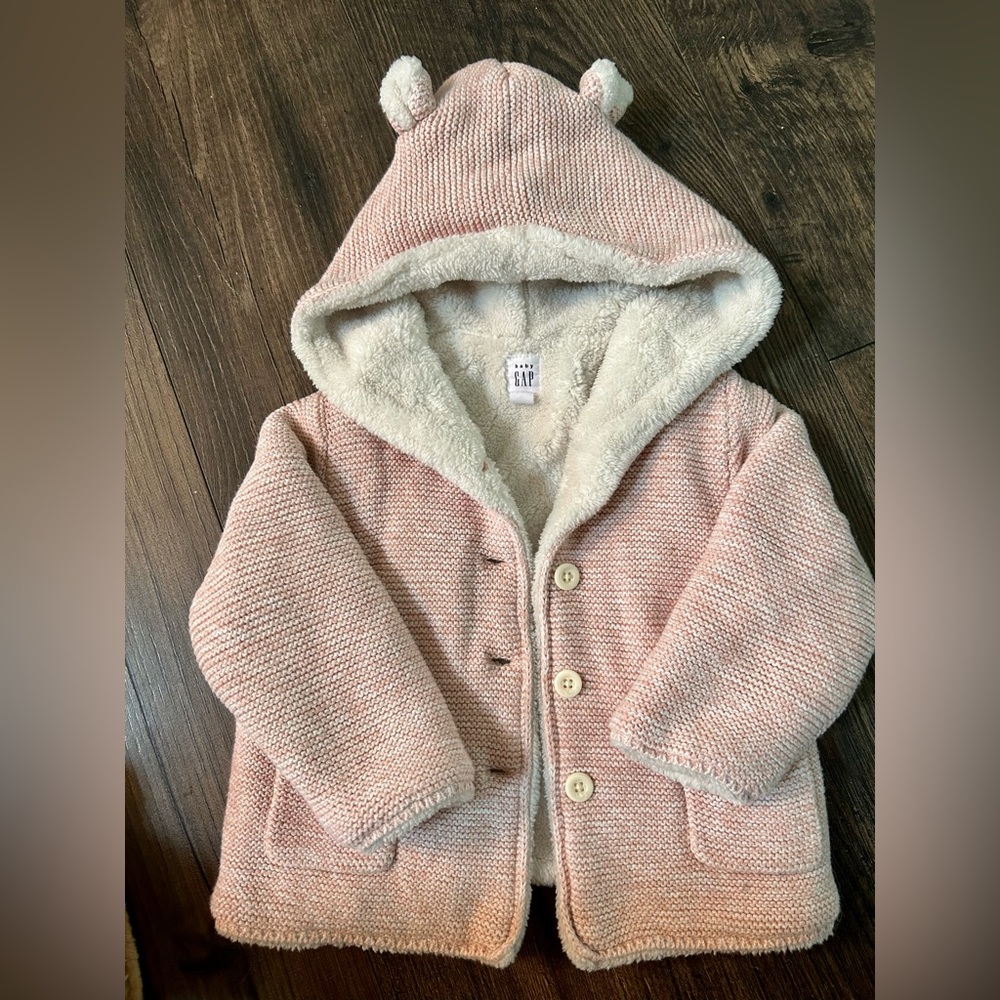 Baby Gap. Size 18-24 months. Worn twice. Warm cozy pink sweater jacket with hood